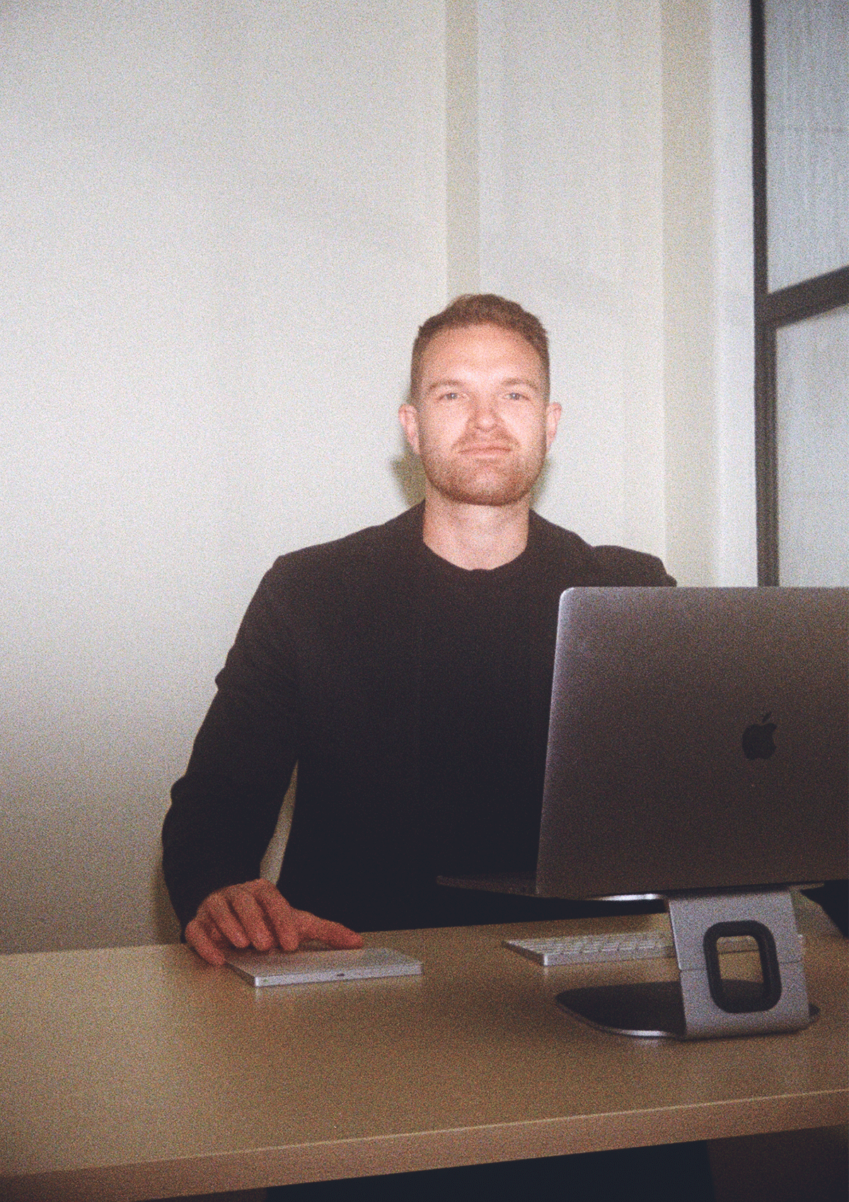 Sam Raines at his desk in his SEO Agency in Auckland